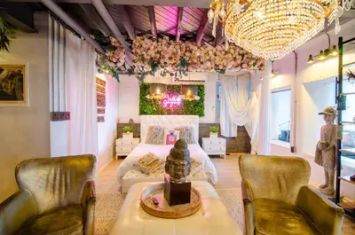 a bedroom with a bed and a table and chairs at Amazing views of NYC and Patio 10 mins from NYC in Union City