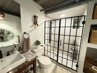 a bathroom with a toilet and a sink at Amazing views of NYC and Patio 10 mins from NYC in Union City