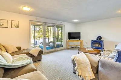 a living room with two couches and a tv at Walk to Beach Arrowhead Lake Home in Pocono Lake