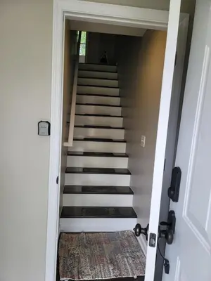 a stairway leading up to a house at Two-Bedroom Home Private Parking 25 min to NYC in Teaneck