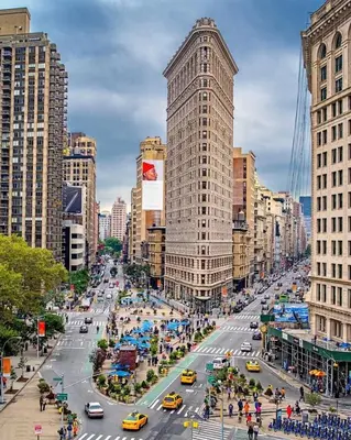 a busy city street with cars and buildings at Chelsea Gem Modern 2BR Apt Prime 23rd & 7th Spot in New York