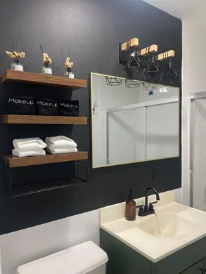 a bathroom with a sink and a mirror at 3br 3bath Duplex NY 23 mins in Hoboken