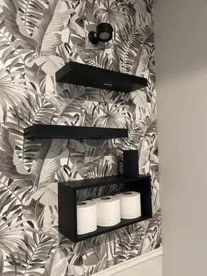 a bathroom with a wall with palm leaves wallpaper at 4br 5ba 4 Car Parking Bonus Rm and Back Yard in East Newark
