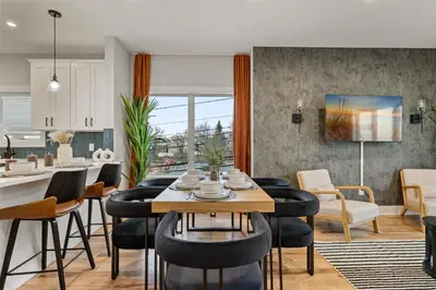a kitchen and dining room with a table and chairs at 2br 3ba 2King bd 3 Car Parking Bonus area with Queen Bed in East Newark