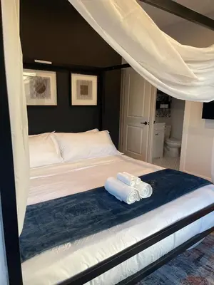 a bedroom with a bed with two towels on it at Free Parkng 2br 2ba 2 King beds EWR 15min in East Newark