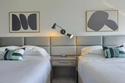 two beds sitting next to each other in a room at Lititz Pointe Inn and Suites in Lititz