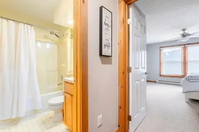 a bathroom with a toilet and a shower and a sink at Your Gateway to Pocono! in Tannersville