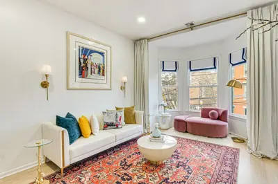 a living room with a couch and a table at 1 Mi to Prudential Center Remote Work-Ready Apt in Newark