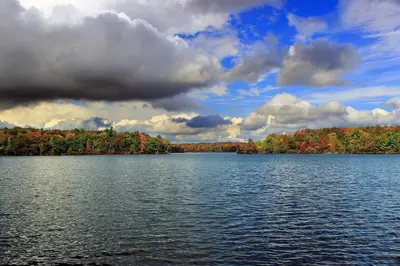 a view of a lake with trees in the background at 1 floor, Pocono Pond house with Game Room in Tobyhanna