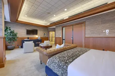 a hotel room with a bed and a couch at The Executive Suites and Events in Ephrata