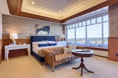 a bedroom with a bed and a couch and a table at The Executive Suites and Events in Ephrata