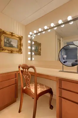 a dressing room with a chair and a mirror at The Executive Suites and Events in Ephrata