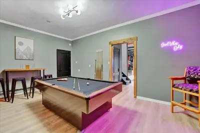 a room with a pool table and a dining room at Lakefront Movie Theater, Hot Tub, Arcade, Boats in Gouldsboro