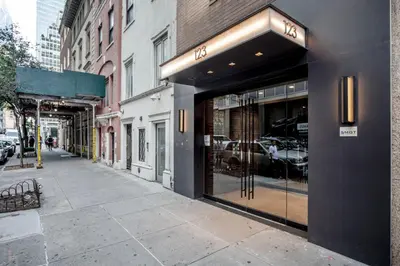 a store front with a sign on a city street at Midtown East 1br w elevator nr transport NYC-1249 in New York