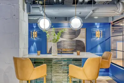 a dining room with blue walls and a table with chairs at Blueground Boerum Hill gym wd nr sports NYC-1573 in New York