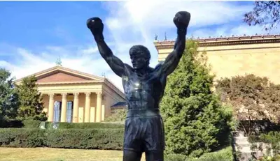 a statue of a man with his arms in the air at New! Suite near Rittenhouse Square in Philadelphia