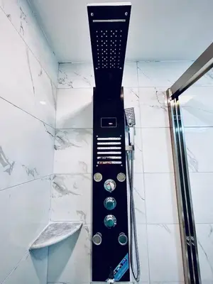 a shower in a bathroom with aaucet at New! Suite near Rittenhouse Square in Philadelphia