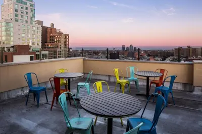 a group of tables and chairs on a roof at Orchard Street Hotel in New York