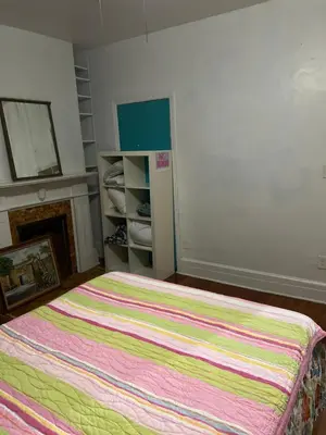 a bedroom with a bed with a colorful blanket at Convenient location near Manhattan easy trip to Times Square in North Bergen