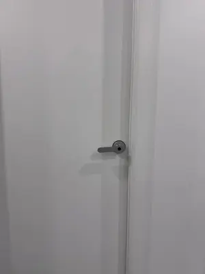 a door with a door knob on a white wall at Private Bedroom with Dedicated Bathroom 15mis NYC in West New York