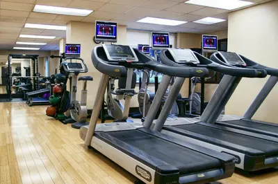 a gym with several tread machines in a room at UWS 1br w gym doorman elevator nr Central Park NYC-1049 in New York