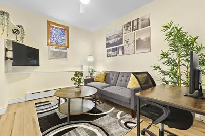 a living room with a couch and a table at Cozy Apartment with Max Comfort in Bayonne