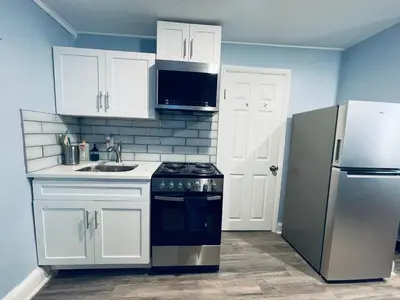 a kitchen with a stove and a refrigerator at Rittenhouse Square close by Kimmel Center Suite in Philadelphia
