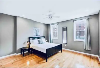 a bedroom with a bed and a ceiling fan at Modern Cozy Huge Balcony in Heart of Passyunk in Philadelphia