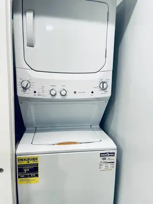 a white refrigerator with a stove top oven at Luxe City Hall Suite by Rittenhouse Square in Philadelphia