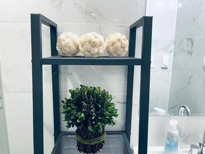 a blue shelf with three teddy bears and a plant at Luxe City Hall Suite by Rittenhouse Square in Philadelphia
