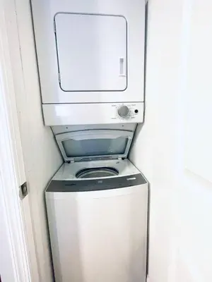 a washer and dryer in a small room at Downtown City Hall close by Kimmel Center 1BD in Philadelphia