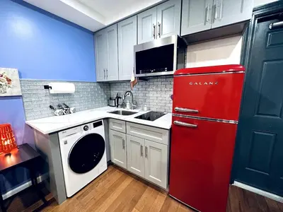 a kitchen with a red refrigerator and a sink at New - Suite nearby Rittenhouse Square in Philadelphia