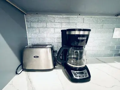 a blender and a toaster sitting on a counter at Stunning 1Bedroom Apartment in Center City in Philadelphia