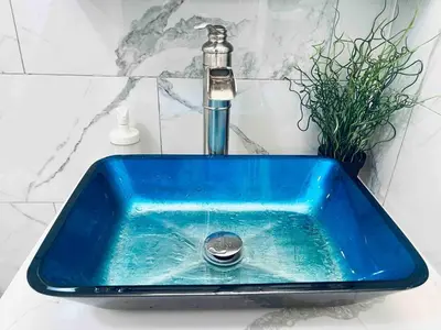 a blue sink with a faucet in a bathroom at Stunning 1Bedroom Apartment in Center City in Philadelphia