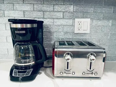 a coffee maker and a toaster sitting on a counter at Magic Gardens 2BD Apt in Center City in Philadelphia