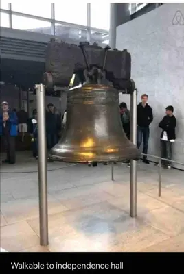 a large bell is on display in a building at New - Suite close by Rittenhouse Square in Philadelphia