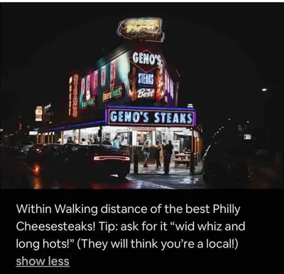a sign for a restaurant on a city street at night at New - Suite close by Rittenhouse Square in Philadelphia