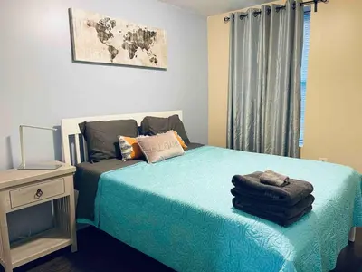 a bedroom with a bed with towels on it at Lovely 1BD Apt Near Magic Garden in Center City in Philadelphia