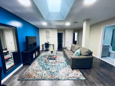 a living room with a couch and a rug at Lovely 1BD Apt Near Magic Garden in Center City in Philadelphia