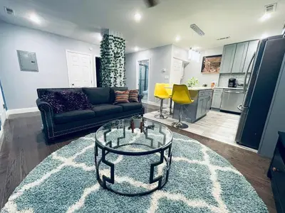 a living room with a couch and a table at Magic Gardens 1BD Apt in Center City in Philadelphia