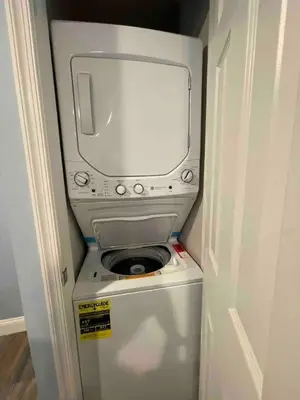 a washer and dryer in a small room at Lovely Beautiful 2BR Apt in Center City in Philadelphia