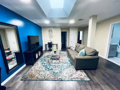 a living room with a couch and a table at Cozy Beautiful 2BD Apt in Center City in Philadelphia