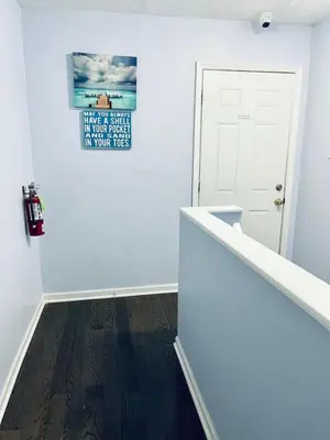 a hallway with white walls and a white door at Cozy Beautiful 2BD Apt in Center City in Philadelphia