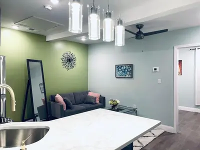 a living room with a couch and a table at Rittenhouse Square nearby Kimmel Center 1BD in Philadelphia