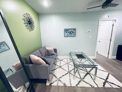 a living room with a couch and a glass table at Rittenhouse Square nearby Kimmel Center 1BD in Philadelphia