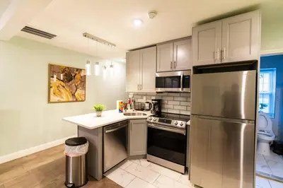 a kitchen with a stainless steel refrigerator at Rittenhouse Square nearby Kimmel Center 1BD in Philadelphia