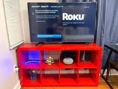 a red entertainment center with a tv on top at Downtown City Hall close by Kimmel Center Suite in Philadelphia
