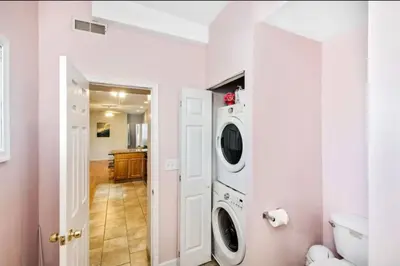 a white laundry room with a washer and dryer at Modern Home w. Deck in Passyunk Square in Philadelphia