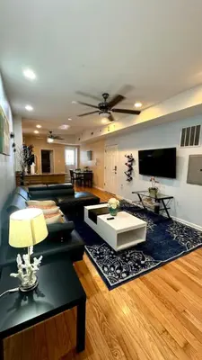 a living room with a couch and a table at Modern Home w. Deck in Passyunk Square in Philadelphia