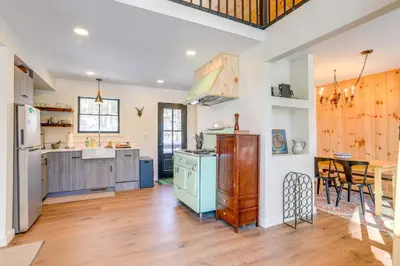 a kitchen with a stove and a counter top at Waterfront Studio with Loft and Dock Near Narrowsburg! in Narrowsburg
